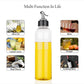 Clear plastic oil bottle, 1 liter, for convenient oil dispensing.