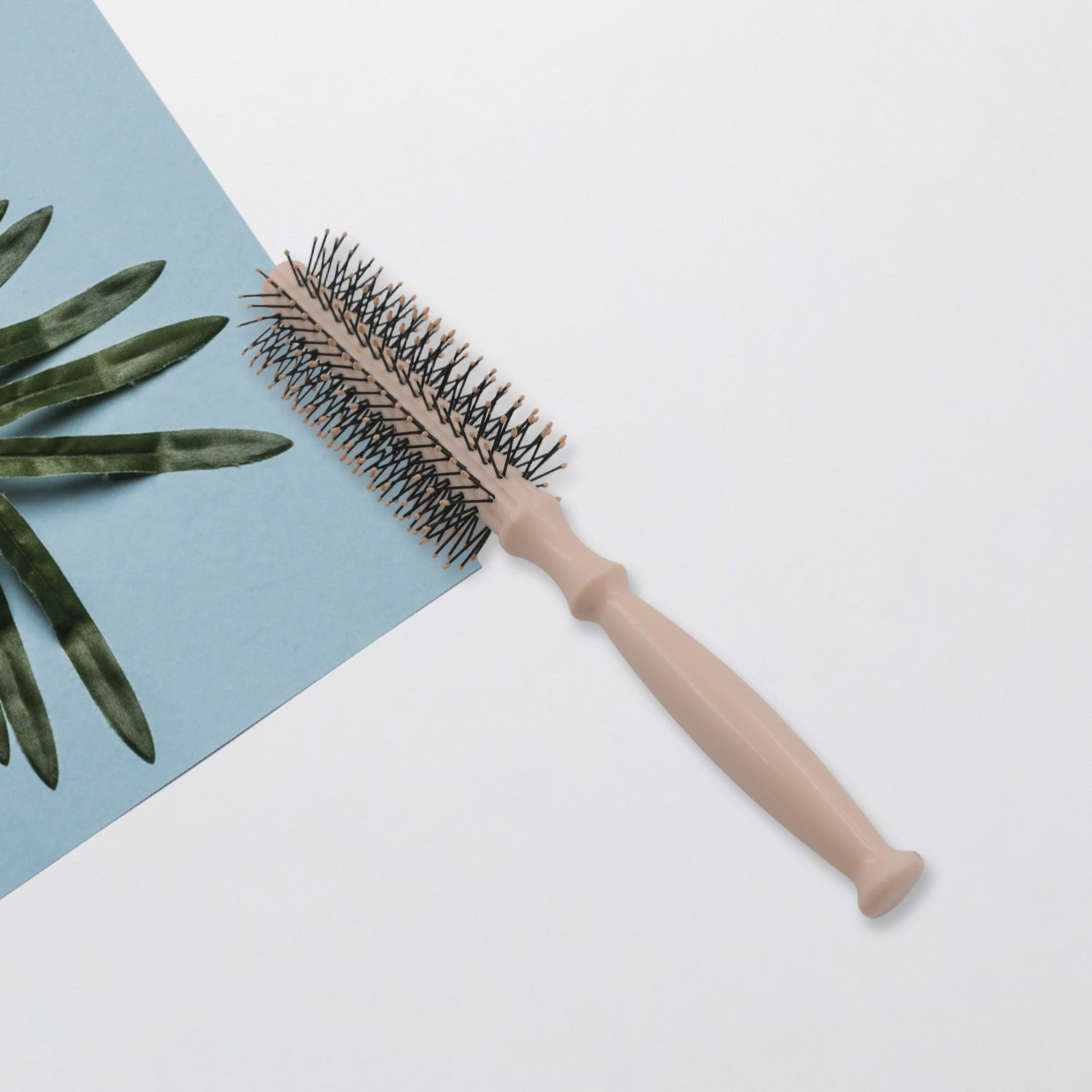 Hair styling brush with round design