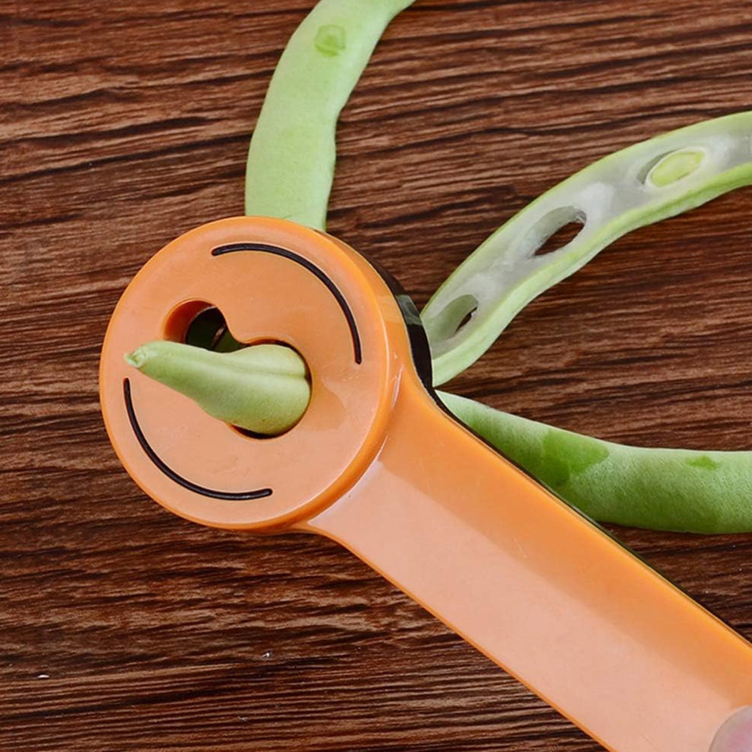 Quick bean slicer and peeler for effortless vegetable cutting.