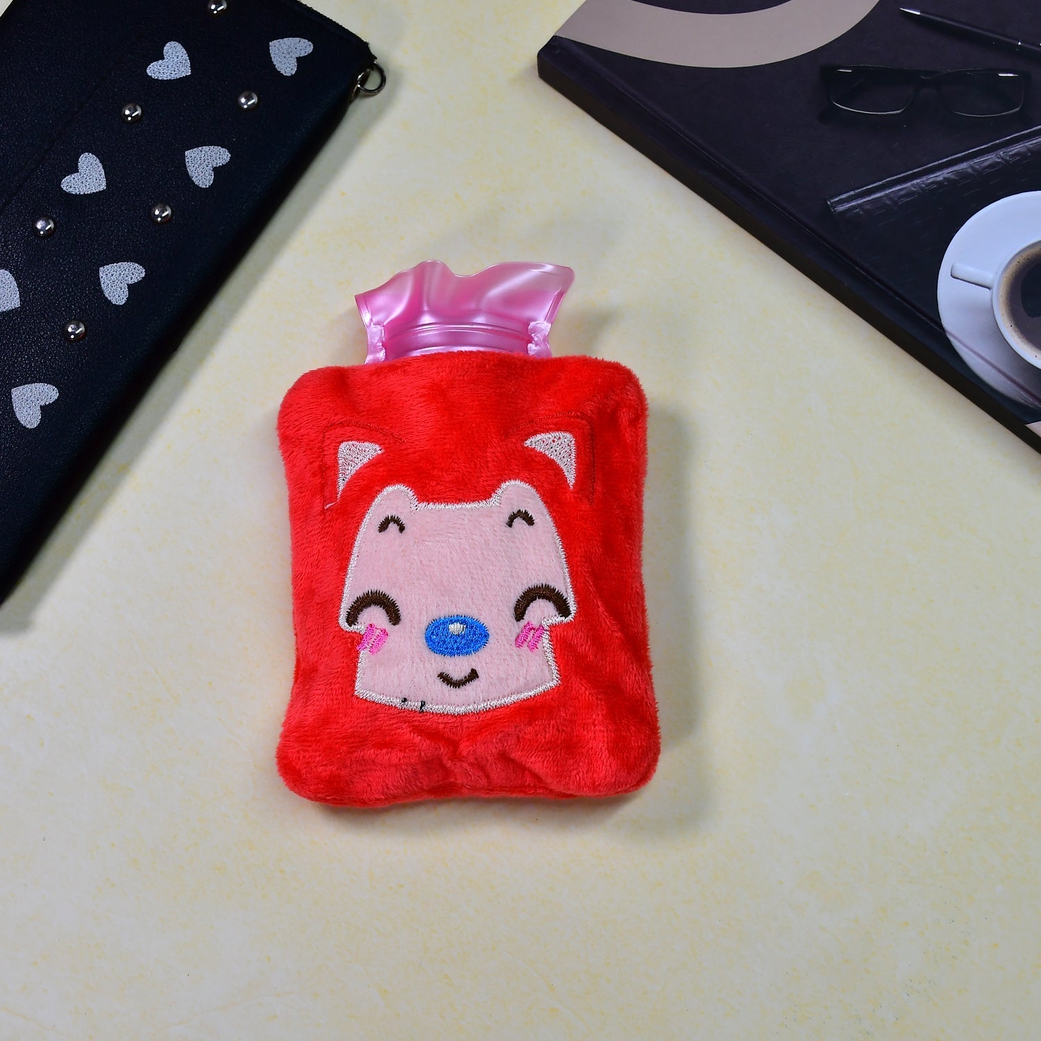 Pink cat hot water bag with cover for soothing menstrual cramps