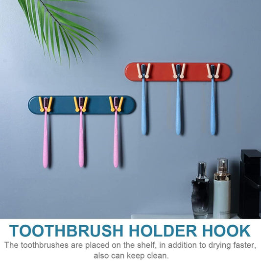 Wall-mounted toothbrush holder with compartments and hooks for bathroom use.