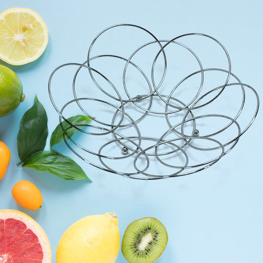 Steel fruit storage bowl with fresh fruits.