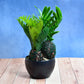 Artificial plant in a stylish pot with lush greenery