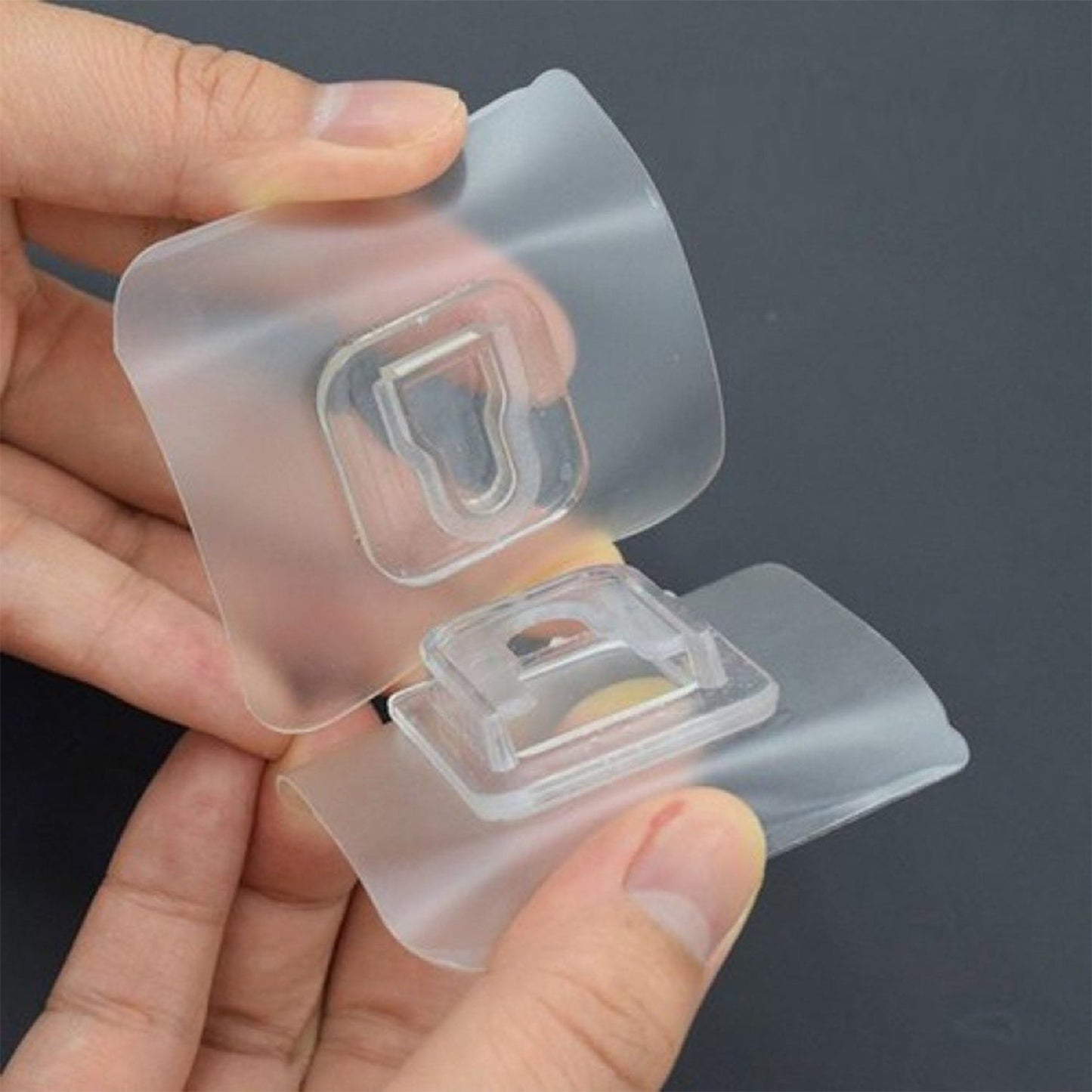 Adhesive hook for easy mounting and hanging with clear design