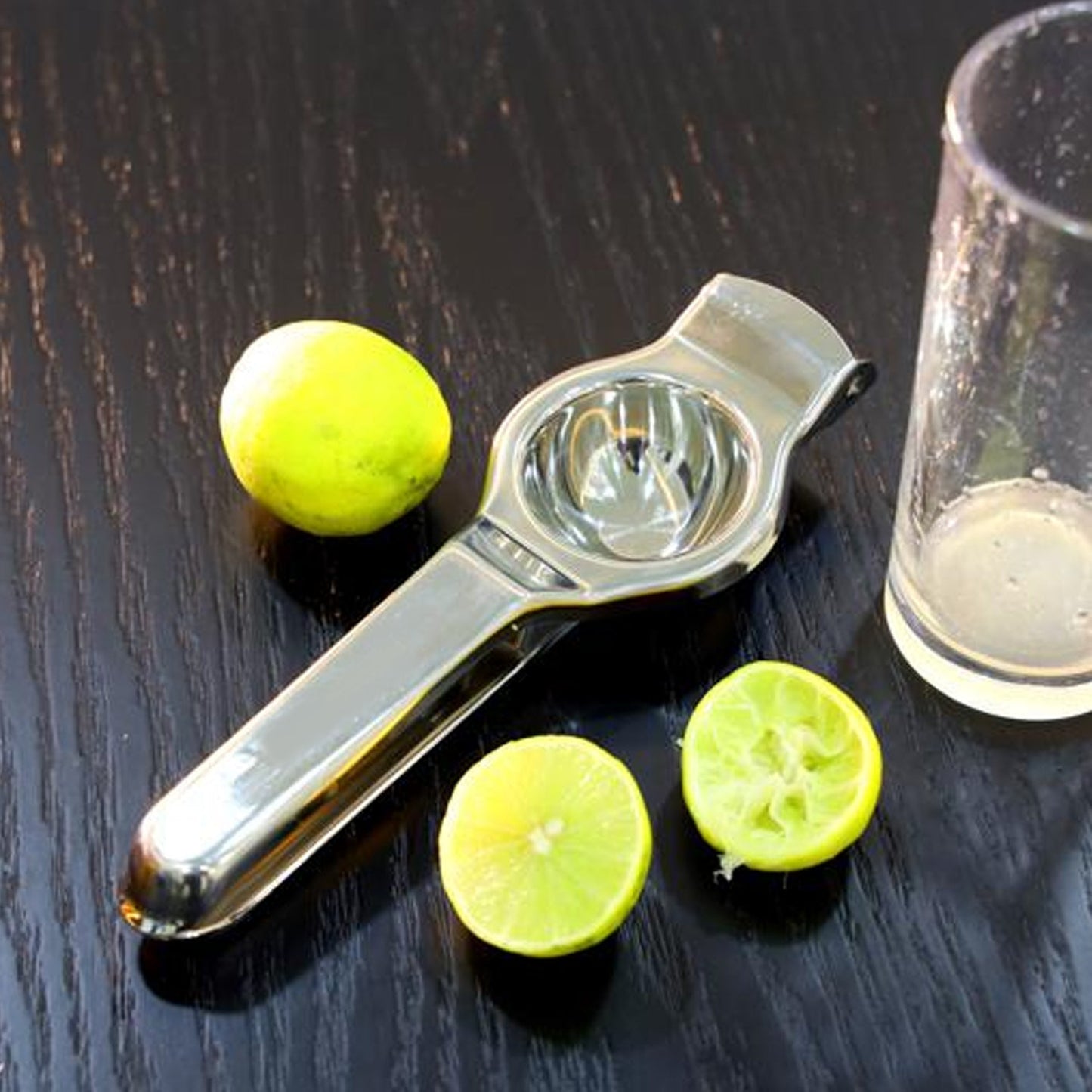 Stainless steel lemon squeezer close-up.