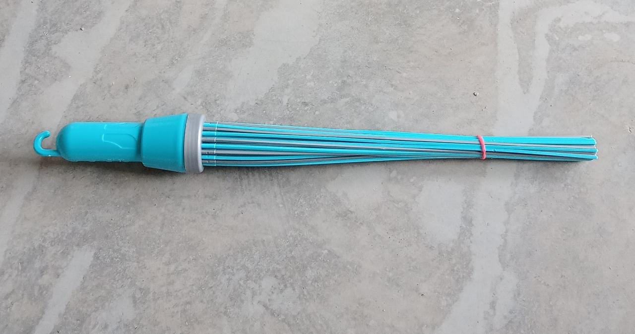 Plastic broom for cleaning, showing bristles and base