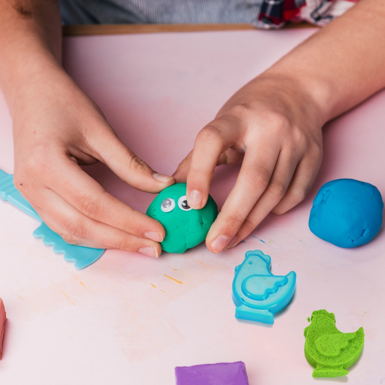 Kinetic sand set with various play tools.