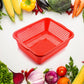 Rectangular plastic drain basket for washing fruits and vegetables in the kitchen sink.