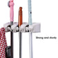 Space-saving mop and broom holder.