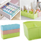 Multi-colored tray with clear plastic and dividers for organizing small beads.