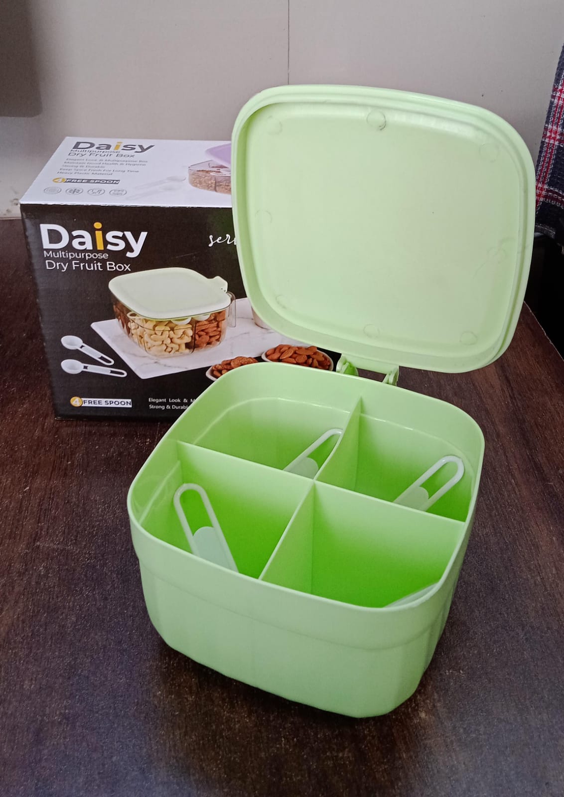 Fancy masala box featuring four compartments for organized kitchen storage.