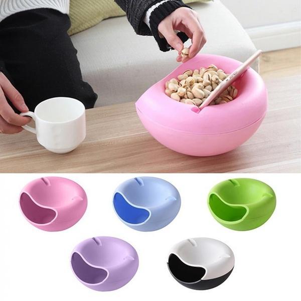 Multi-use snack platter with an integrated mobile phone holder.