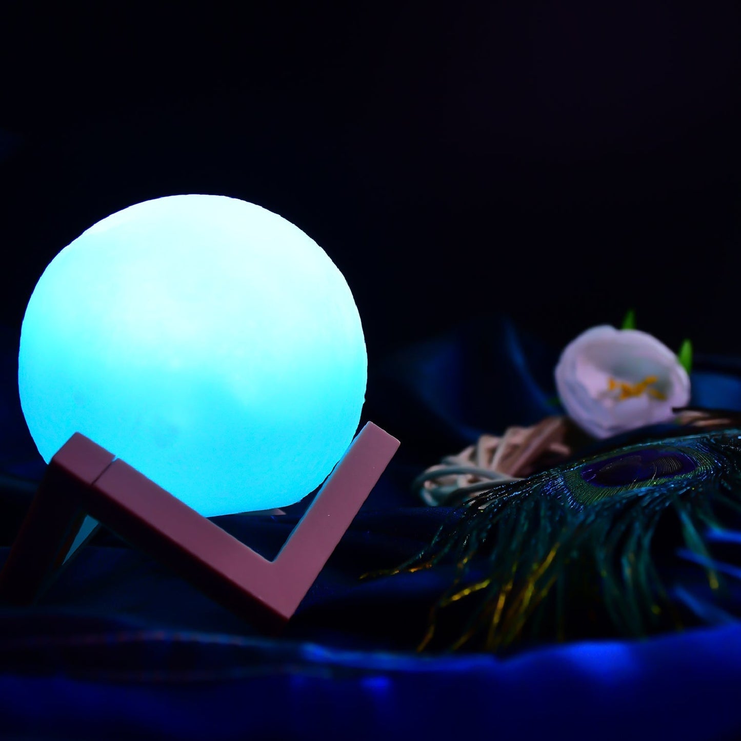 Blue moon night lamp with wooden stand for bedroom use.