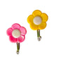 Pack of 5 adhesive flower-shaped hooks for wall decor.