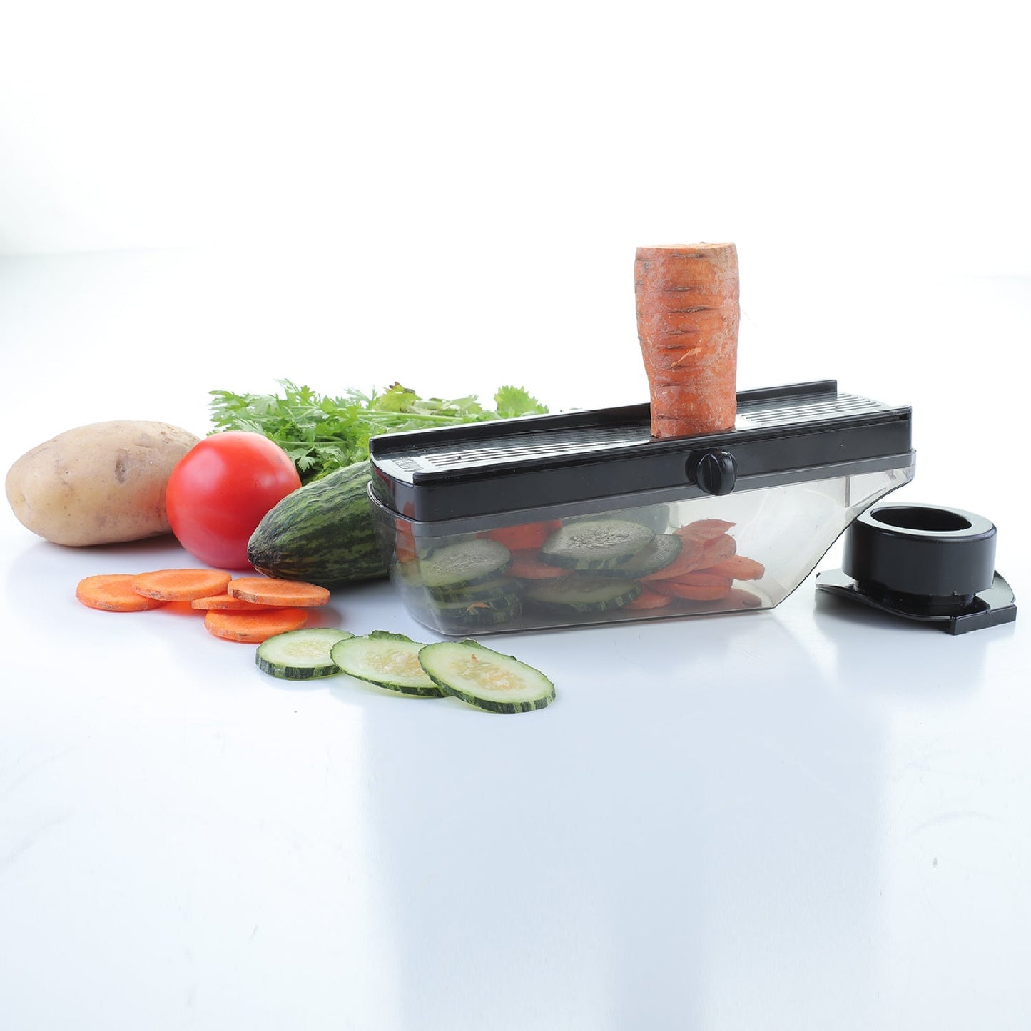 Ganesh black plastic slicer cutter for vegetables, shown from different angles.