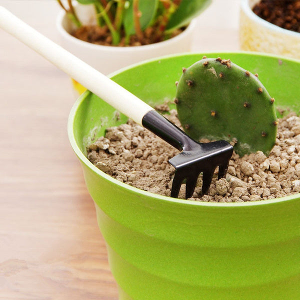 Kid's gardening set with trowel, shovel, and rake