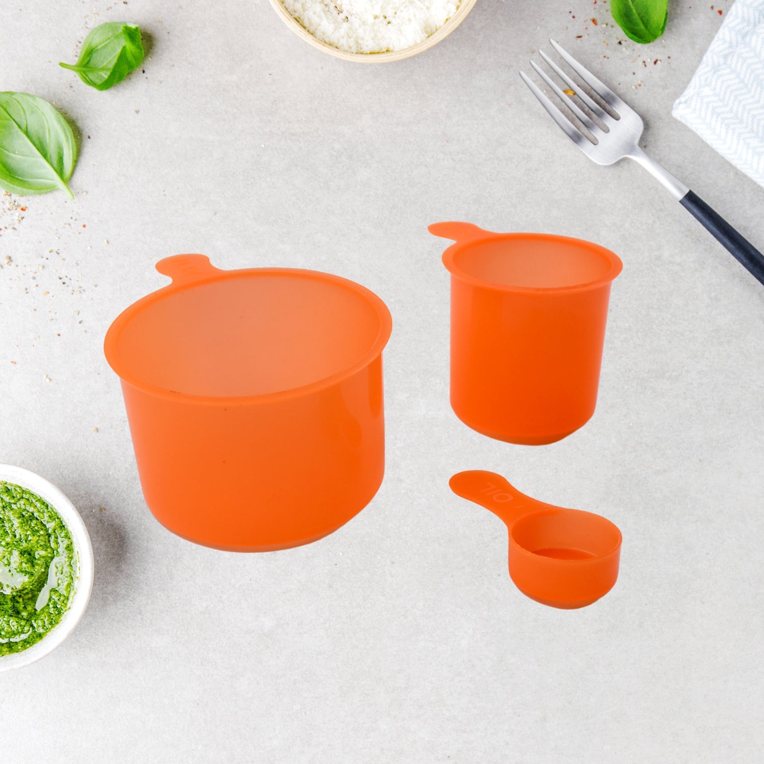 Dough making machine with measuring cup.