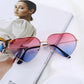 Trendy heart-shaped sunglasses with multi-color mirror lenses.