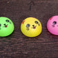 Smiley face toy with pull back action