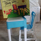 Children's study table and chair set in blue, features a pencil box and sturdy plastic build.