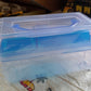 Plastic storage case with handle, designed for various uses including art supplies and fishing gear.