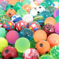 Collection of 14 bouncy balls with bright colors and fun patterns.